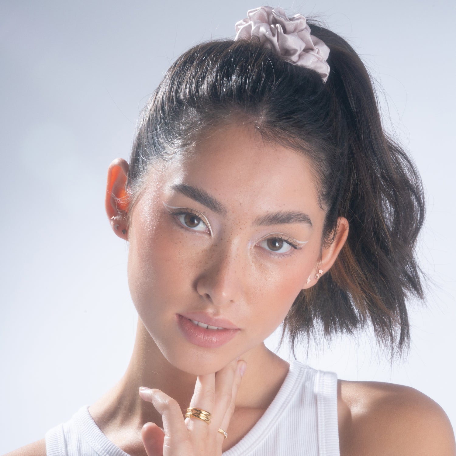 Woman wearing a Moon Dust silk scrunchie
