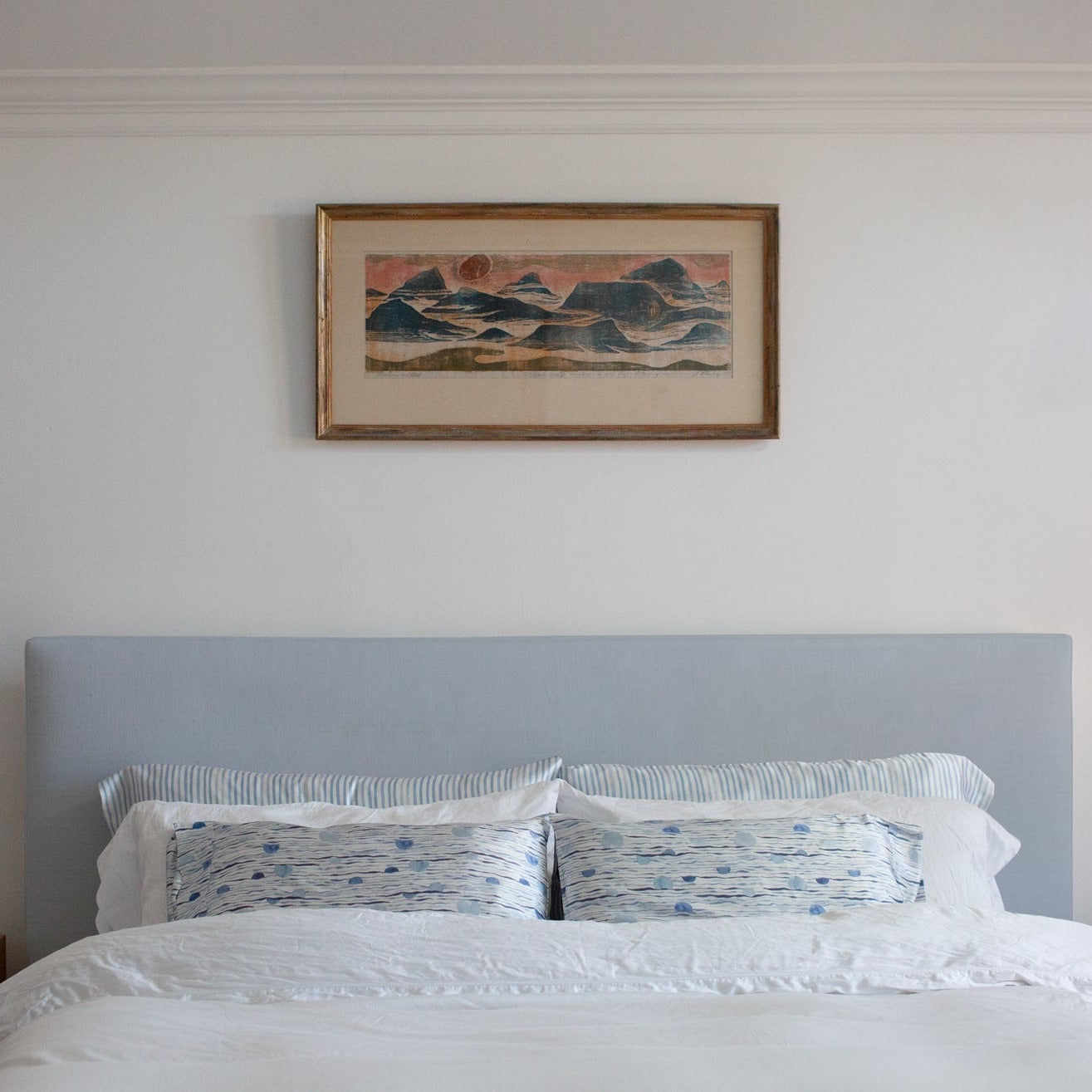 Moon Tide mini silk pillowcases on a bed